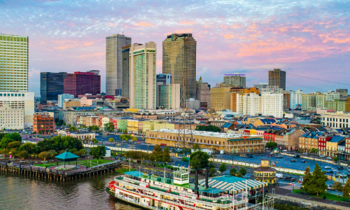 Riverboat and New Orleans skyline during daytime