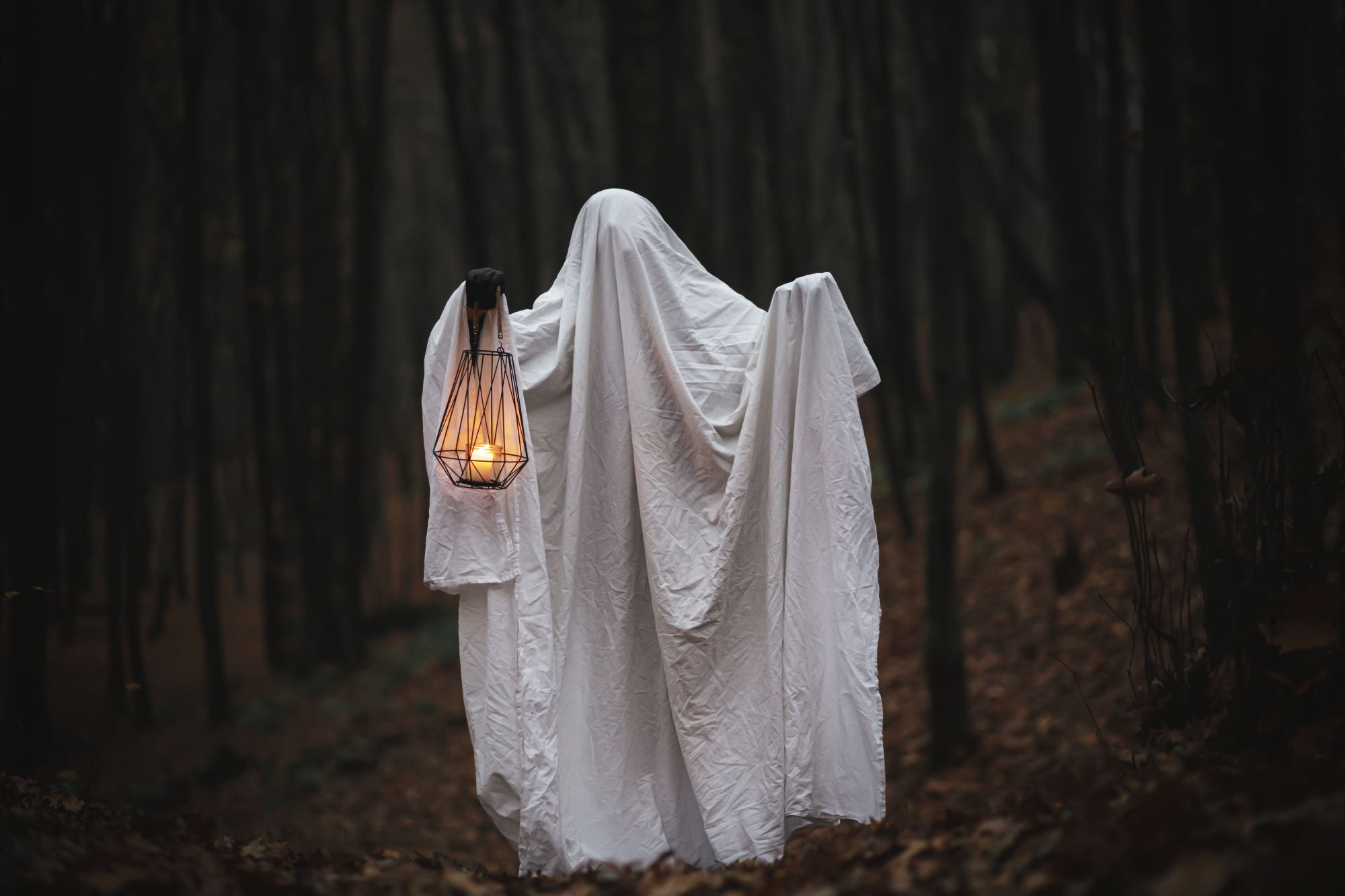 spooky ghost carrying a lantern